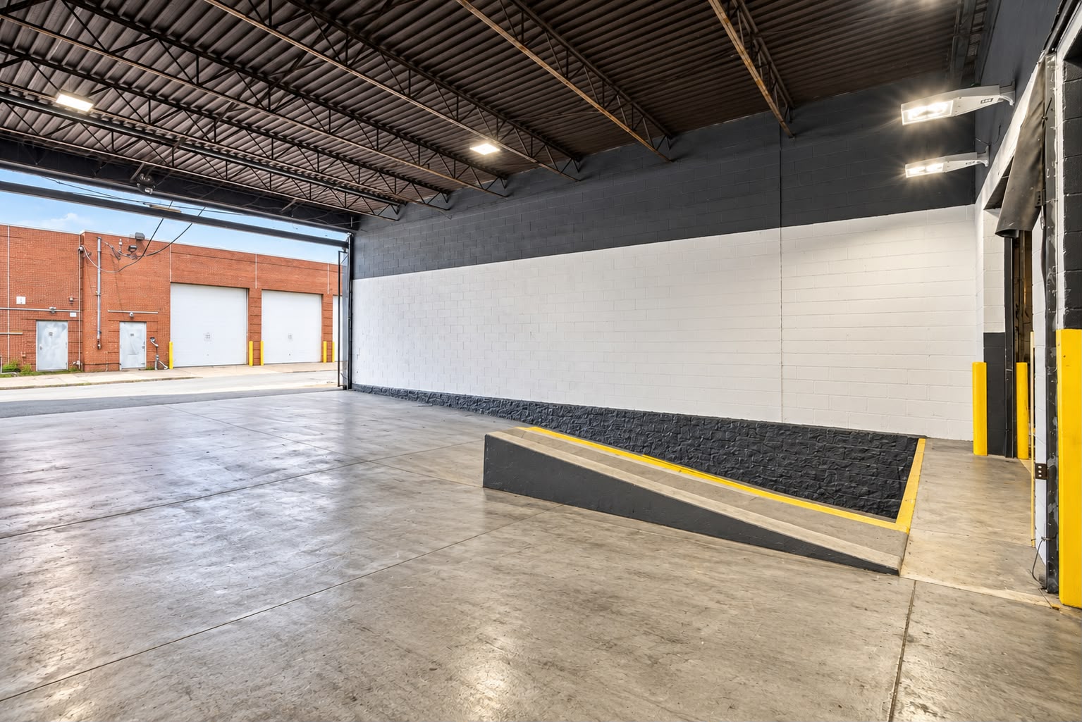 Drive-in ramp bay with open overhead door at the JA Philadelphia warehouse