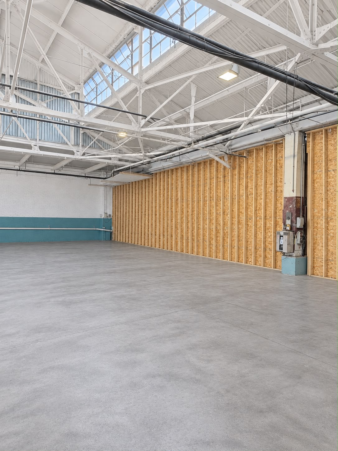 Large empty warehouse storage space with high ceilings and a smooth concrete floor at JA Transportation & Warehousing